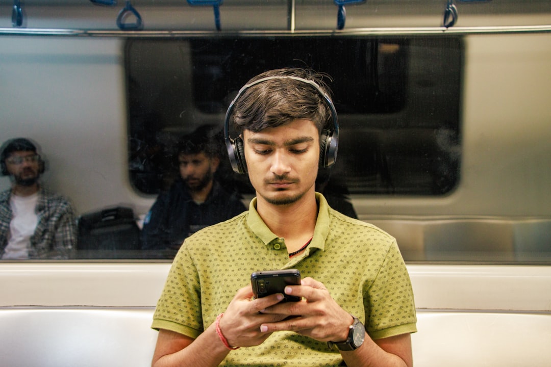 People using smartphones to listen to on-demand audio content