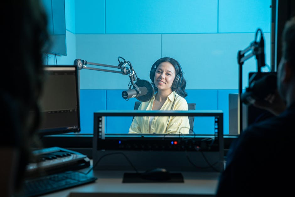 A modern radio station control room with equipment for both voice tracking and live broadcasting